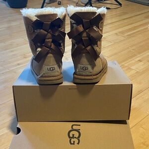 UGG Kids Chestnut Suede Sheepskin Boots with Brown Satin Bows